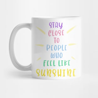 Stay close to people who feel like sunshine Mug